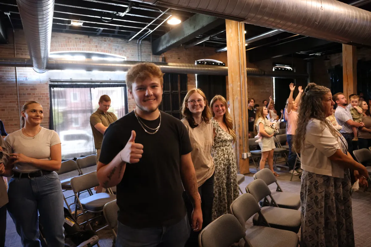 Church members smiling and talking together after a service