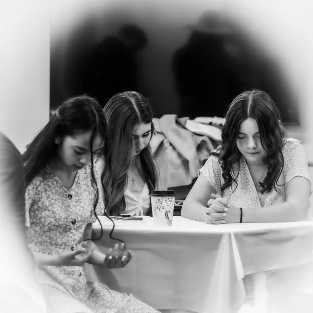 Teens praying together